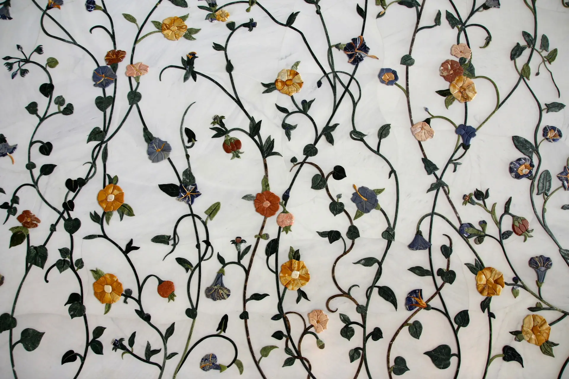 white embroidered fabric with flowers