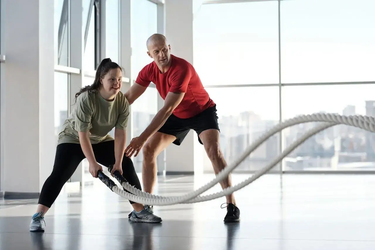 man and woman doing gym training